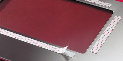 Trim adhesive for mounting to a substrate
