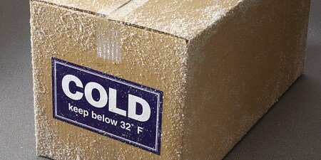Taped box in cold temperature with label reading cold keep below 32 degrees Fahrenheit
