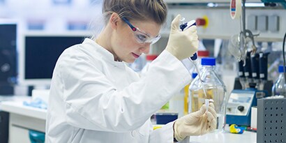 woman performing science lab test
