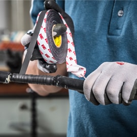 Image showing application of EMD Linered Rubber Splicing Tape 23 to motor lead cable