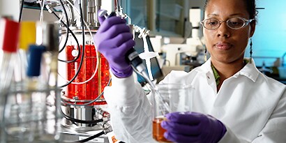 woman performing science lab test
