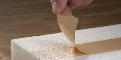 3M Urethane adhesive tape applied on a piece of white foam
