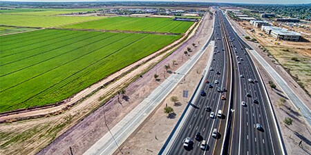 Aerial shot of a busy rural highway.
