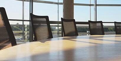 Sunlight streams through a boardroom window with 3M™ Window Films covering, leaving no worry of hot or cold spots. 