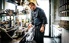 chef working behind the counter to prepare food at a hip restaurant