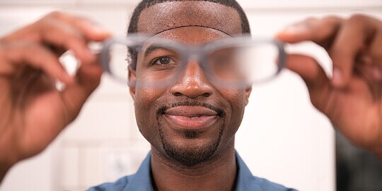 Man holding Scothgard eye ware
