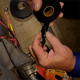 Image from instructional video on building a conductor jacket using Scotch® Linerless Rubber Splicing Tape 130C and Scotch® Super 33+™ Vinyl Electrical Tape