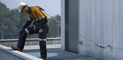 3M Permanent Horizontal Permanent Lifeline in use on a rooftop ledge
