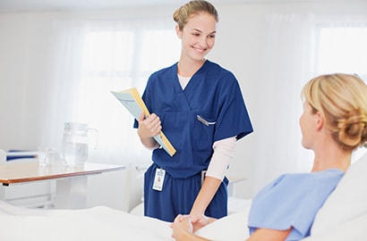A nurse with a patient in the hospital.