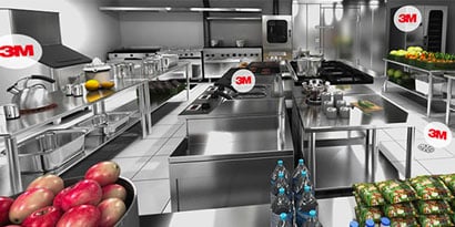 In a commercial kitchen, a woman with a clipboard points up as a chef looks on.
