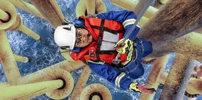 Person working at height on oil rig wearing 3M Fall Protection
