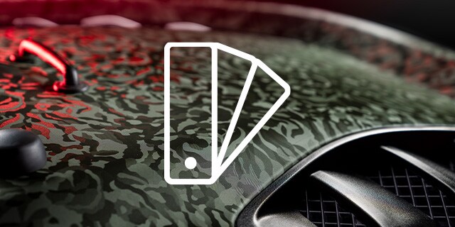 Detail shot of camo pattern wrap film on hood with swatch icon
