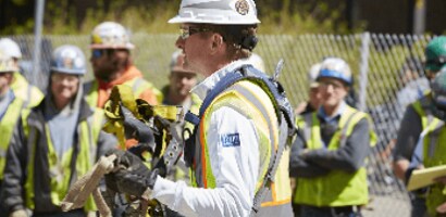 Fall protection trainer on construction worksite
